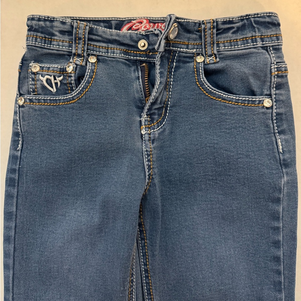 Cowgirl Hardware jeans. Girls Size 6. Medium wash cow print. Boot cut jeans
